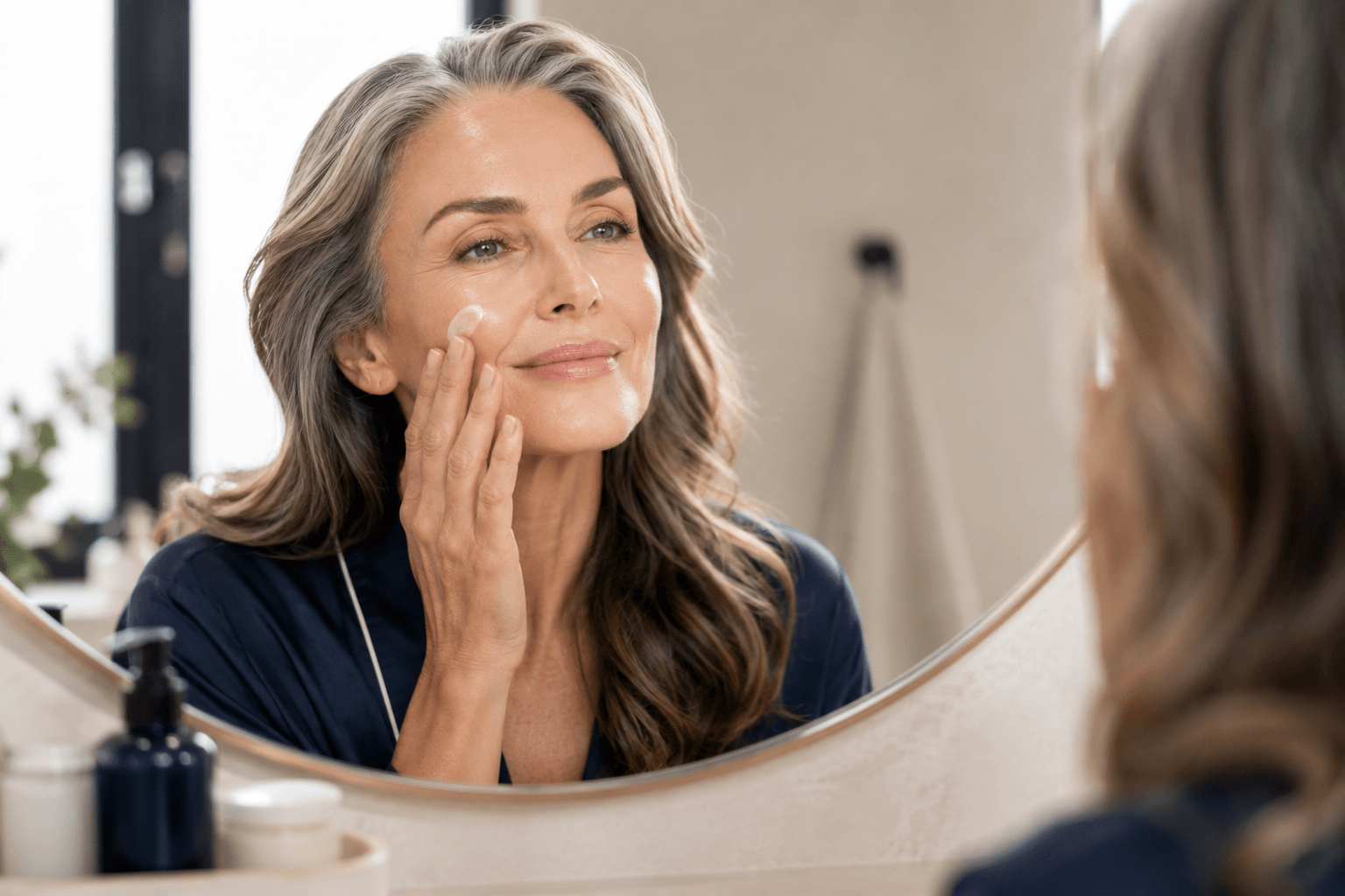 Woman over 50 doing her morning menopause skincare routine